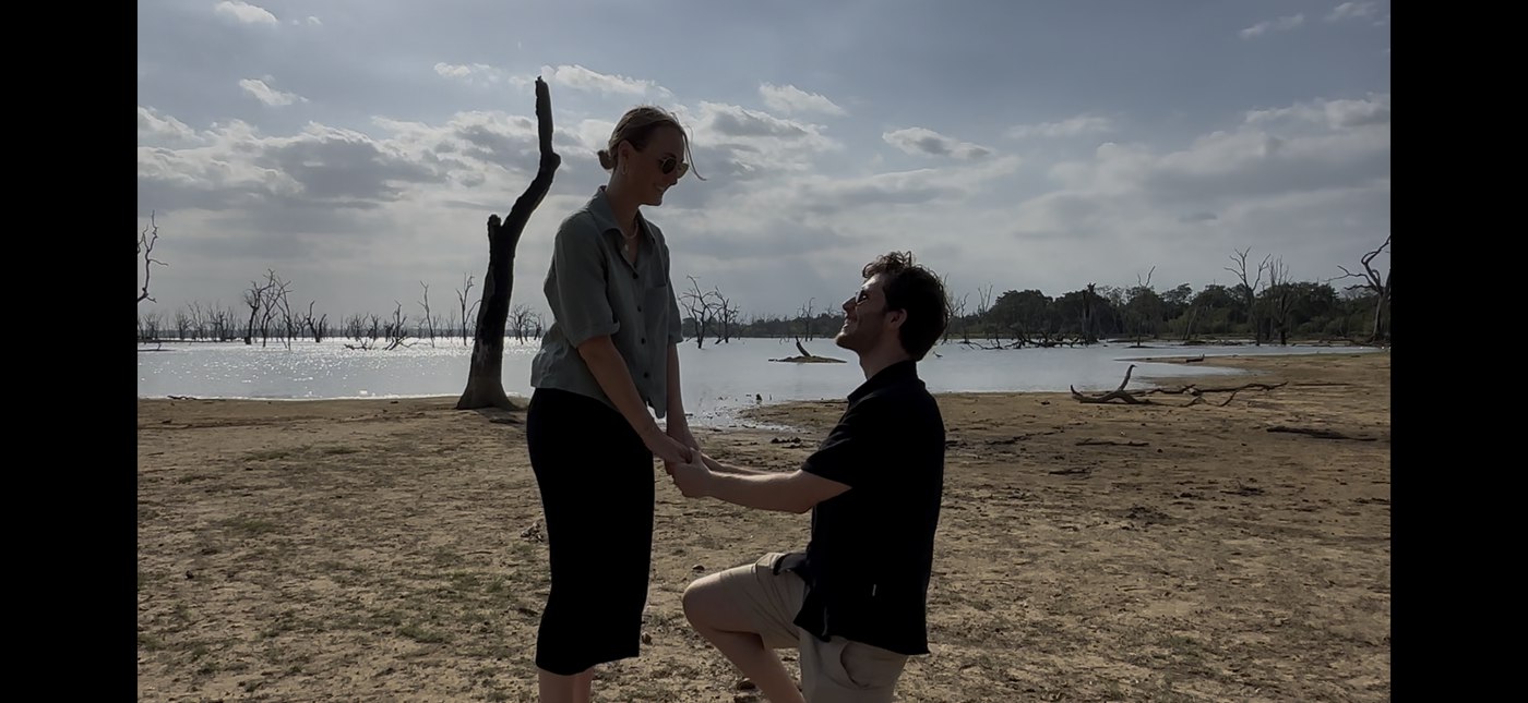 Leonard on one knee proposing to Mona in Yala National Park, Sri Lanka