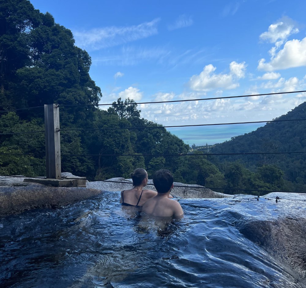 Leonard and Mona in a jungle infinity pool in Langkawi