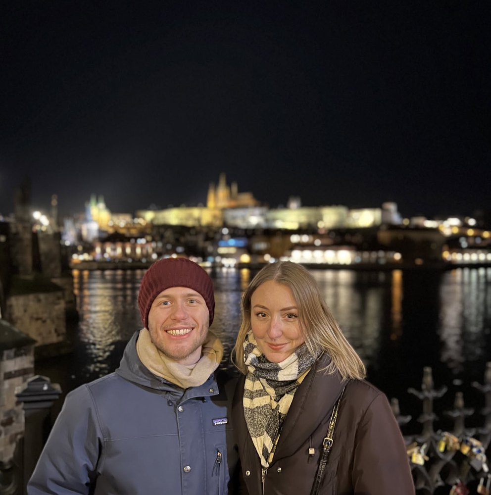 Leonard and Mona with Prague Castle lit up behind them