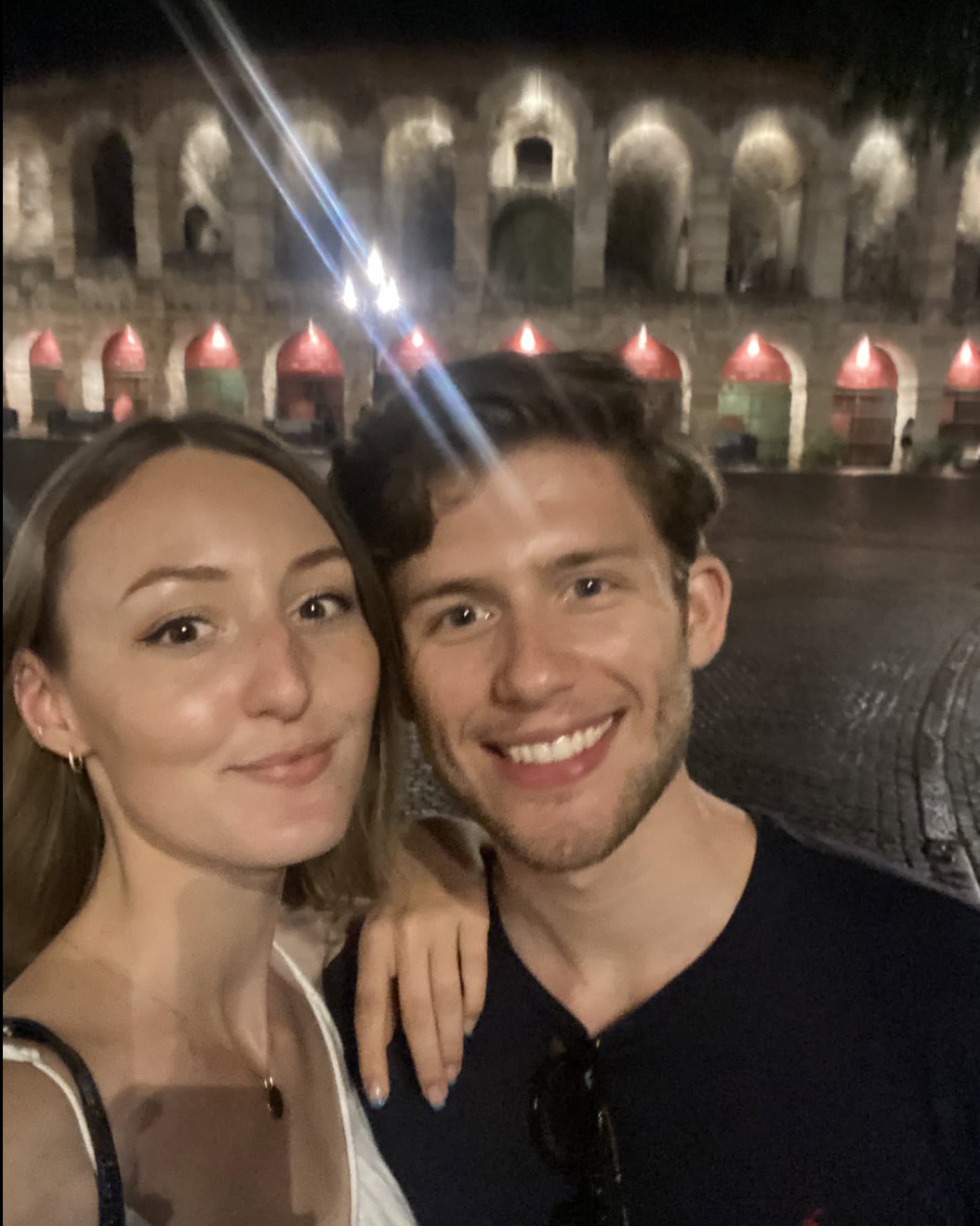 Leonard and Mona in front of the Verona Arena at night