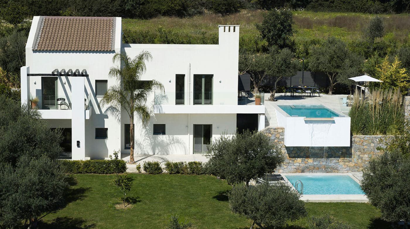 Arbora Olea villa exterior with infinity pool and waterfall
